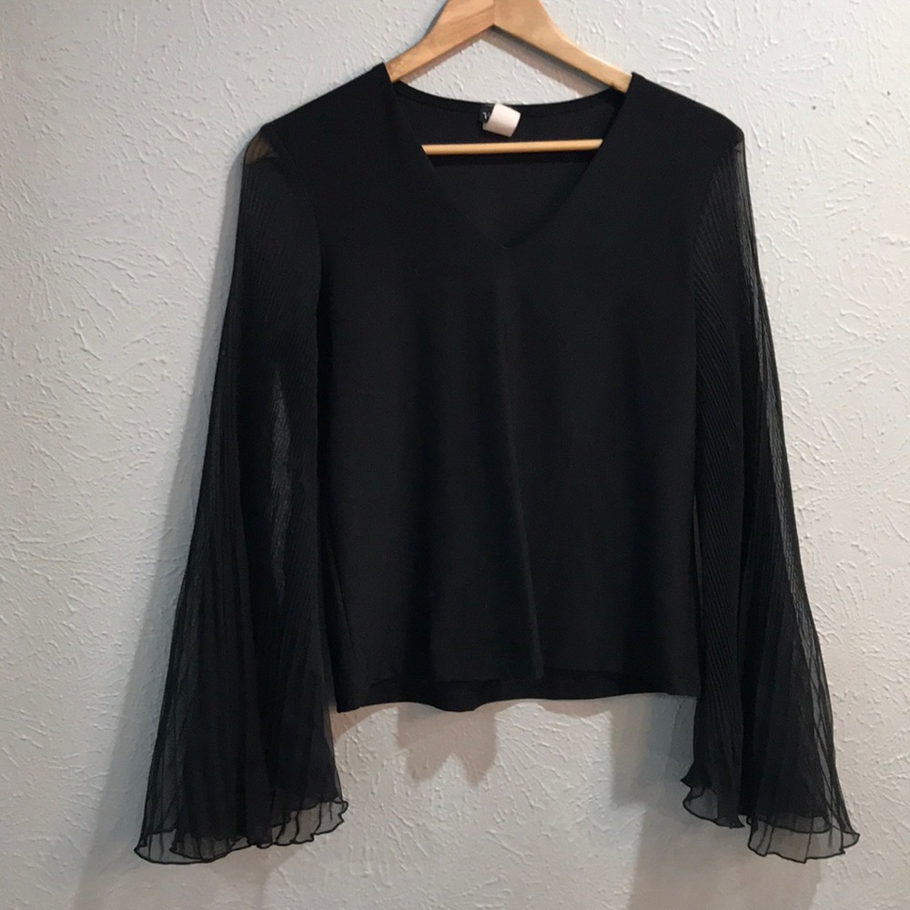 Bell sleeved black top